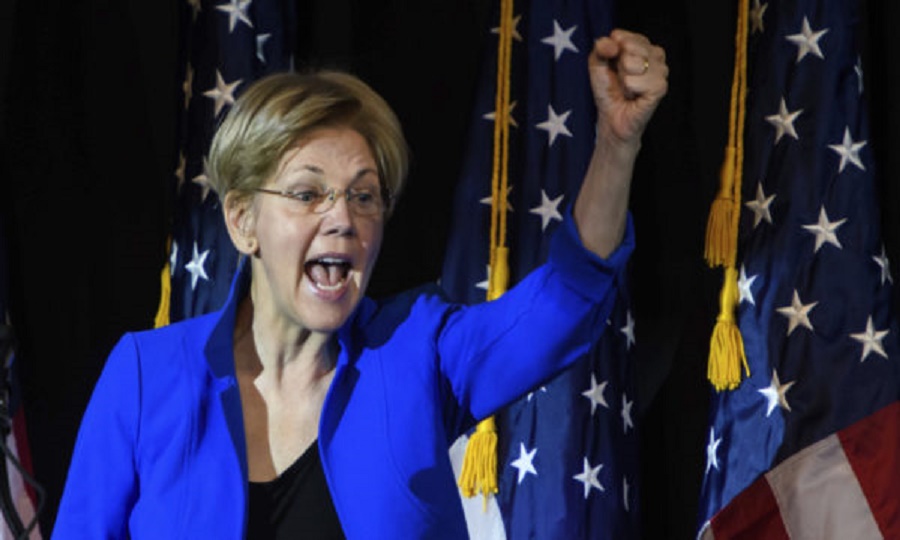 In this photo taken Oct. 14, 2016, Sen. Elizabeth Warren, D-Mass. speaks at a rally for Missouri Democratic Senate candidate, Secretary of State Jason Kander, in Kansas City, Mo. From liberal California to conservative Missouri, there are few places Warren won’t go this election season. The Massachusetts Democrat is campaigning for Hillary Clinton, for Senate candidates and for progressive policies, banking political capital that she could end up spending in ways Clinton and other Democratic leaders won’t like. (AP Photo/Reed Hoffmann)