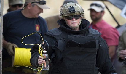 Belgian army First Sgt. Maj. Nele Van Keer prepares an explosive charge during the Raven's Challenge exercise at Camp Pendleton, Calif., Aug. 1, 2017. Raven's Challenge is an Army-funded exercise led by the Bureau of Alcohol, Tobacco, Firearms and Explosives, with support and participation from multiple federal, state and local agencies. DoD photo by EJ Hersom